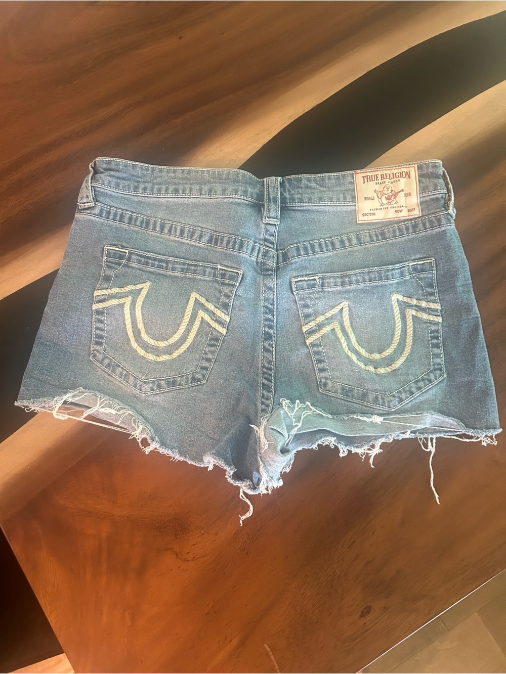 True Religion Light Blue Denim Cutoff Shorts with Distinctive Back Pockets